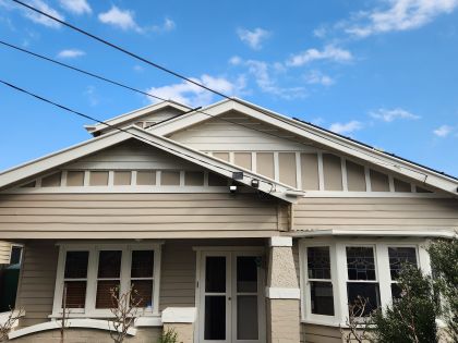 Two-storey weatherboard home in Moonee Ponds after exterior repaint